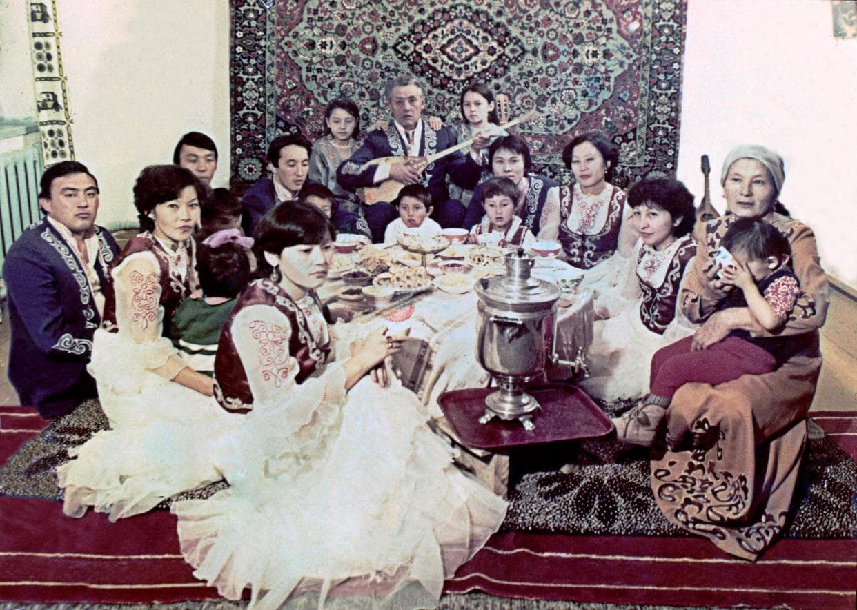 The Islyamov family gathered around a festive table